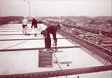 Full-deck-width precast concrete panels connected to steel girders 