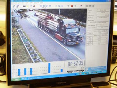 Photo of a computer screen showing a video image of a commercial truck on a roadway.