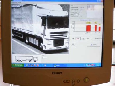Photo of a computer screen showing a video image of a commercial truck on a roadway.