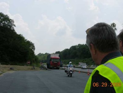 Photo of people observing traffic at a mobile enforcement operation in France.