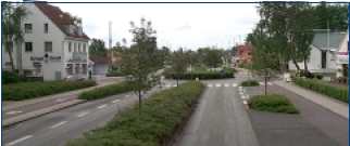 Combination of several traffic calming elements: islands, roundabout, and narrow lanes, Denmark