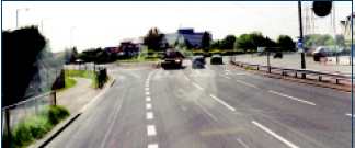 Roundabout with three lanes and traffic signal control, England