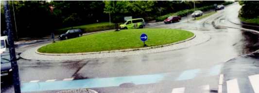 Bike path sharing the roadway, but color coded, Denmark