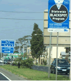 Photo of roadside sign indicating location of Victoria blackspot safety improvement project.