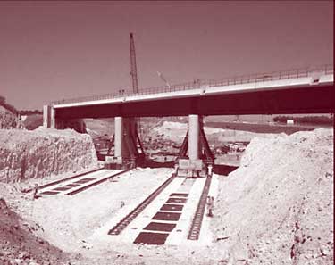 Skidding a bridge into position