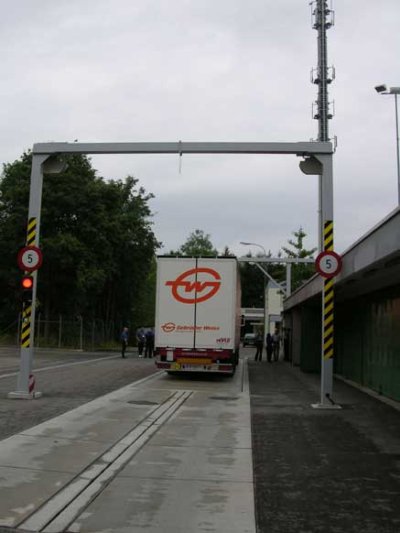 Photo taken from the rear of a truck being measured by a vehicle profiler system in Switzerland.