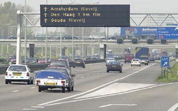 Photo of a dynamic route information panel on a gantry in the Netherlands.