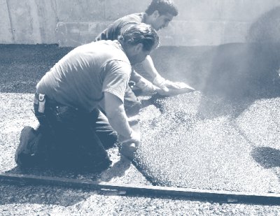 Photo of crew placing mastic asphalt.