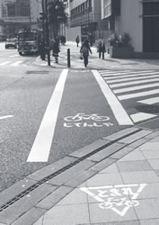 Photo of a crosswalk with separate lanes for bicycles and pedestrians