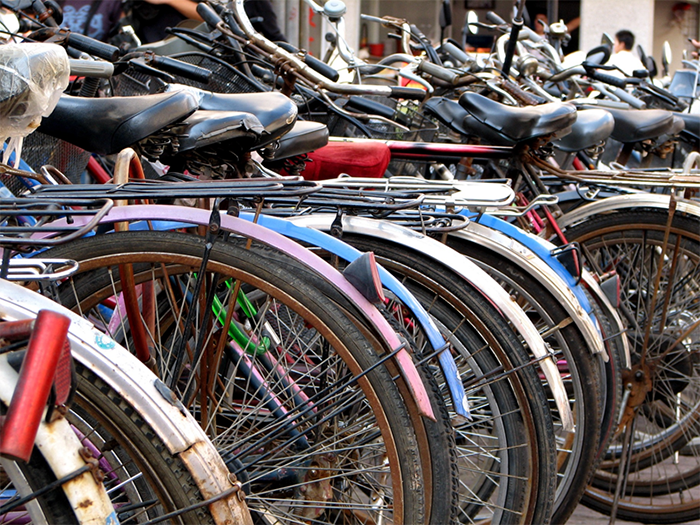 Introduction Picture - Description: Picture of bike rack filled with bikes of ranging colors 