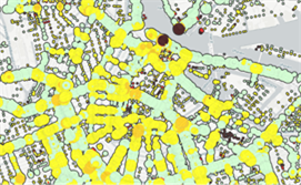 Table 3 Example of bicycle data using Fietstelweek - Description: An aerial view of a map showing the data collected about delays experienced. Yellow, green, and brown paths and dots are shown, and the darker the color the greater the delay.