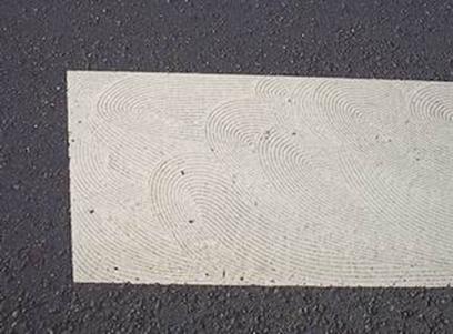 Figure 11. Photo of troweled pavement marking binder material to increase texture and friction.