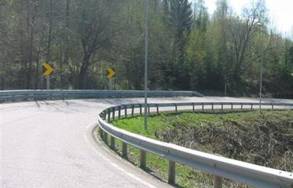 Figure 19. Photo of Norwegian Vision Zero Motorcycle Road After brush clearing and installation of motorcycle barrier on outside of curve.