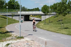 Photo of cyclist traveling on bicycle underpass in Lund.