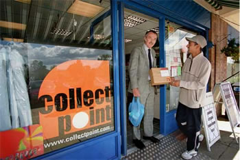 Photo of storefront with Collectpoint sign in window and two people with package standing at door.